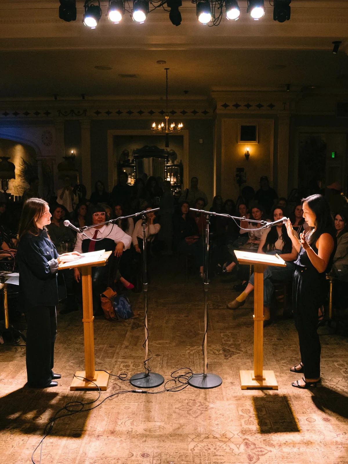 Students debating at podiums during a Washington Debate Academy round