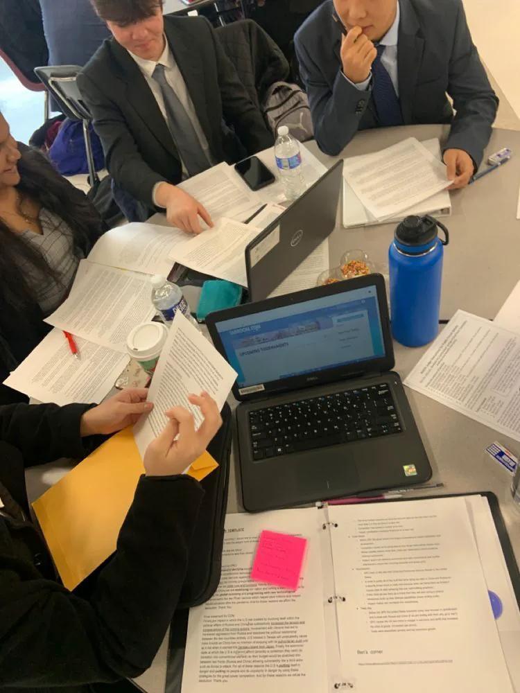 Students preparing case materials together at Washington Debate Academy